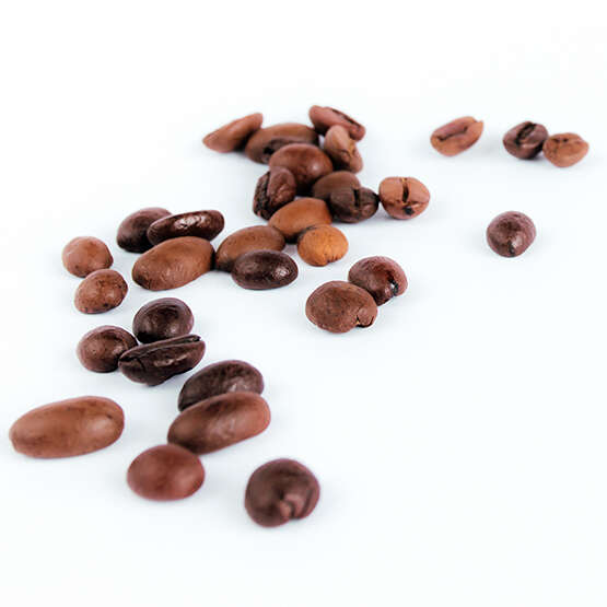 Roasted coffee beans on the white background. High quality photo